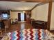 Open dining area with wood floors and built-in hutch at 1668 Lane Rd, Mount Holly, NC 28120