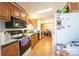 Kitchen with wood cabinets, electric stove and microwave at 1668 Lane Rd, Mount Holly, NC 28120
