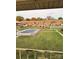 Community pool area with covered patio and surrounding lawn at 2123 Carriage Woods Ln, Kannapolis, NC 28081