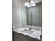 Clean bathroom with white vanity and quartz countertop, reflecting light at 2123 Carriage Woods Ln, Kannapolis, NC 28081