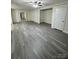 Spacious living room with grey vinyl flooring at 2123 Carriage Woods Ln, Kannapolis, NC 28081