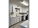 Updated kitchen with white cabinets and quartz counters at 2123 Carriage Woods Ln, Kannapolis, NC 28081