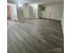 Spacious living room featuring light gray vinyl plank flooring throughout at 2123 Carriage Woods Ln, Kannapolis, NC 28081
