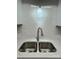 Double stainless steel sink with modern faucet and white countertop at 2123 Carriage Woods Ln, Kannapolis, NC 28081
