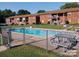 Inviting community pool with ample deck space and picnic tables at 2123 Carriage Woods Ln, Kannapolis, NC 28081