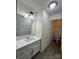Bright bathroom with white vanity, quartz countertop, and a separate toilet area at 2123 Carriage Woods Ln, Kannapolis, NC 28081