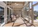 Relaxing screened porch with seating area and patio heater at 364 Catalina Dr, Mooresville, NC 28117
