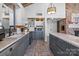 Modern kitchen with gray cabinets, marble countertops, and stainless steel appliances at 364 Catalina Dr, Mooresville, NC 28117