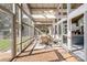 Bright screened porch with brick flooring, seating area, and view of backyard at 364 Catalina Dr, Mooresville, NC 28117