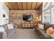 Spacious living room with exposed brick wall and comfortable sofas at 364 Catalina Dr, Mooresville, NC 28117