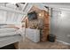 Bedroom with brick feature wall and built-in dresser at 364 Catalina Dr, Mooresville, NC 28117