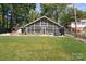 Mid-century modern lake house with large screened porch at 364 Catalina Dr, Mooresville, NC 28117