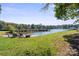 Lakefront backyard with grassy area and seating at 364 Catalina Dr, Mooresville, NC 28117