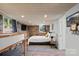 Basement bedroom with brick accent wall, bunk beds, and queen bed at 364 Catalina Dr, Mooresville, NC 28117