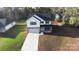 Two-story house with gray roof, white siding, and a two-car garage at 5319 Carden Dr, Charlotte, NC 28227