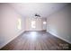 Spacious living room with hardwood floors and neutral walls at 5319 Carden Dr, Charlotte, NC 28227