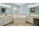 Large bathroom with corner tub and double vanity at 5670 Gold Creek Bay Dr, Hickory, NC 28601