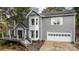 Two-story home with gray siding, deck, and attached garage at 5670 Gold Creek Bay Dr, Hickory, NC 28601