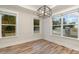 Breakfast nook with hardwood floors and large windows at 605 Julia Ave, Belmont, NC 28012