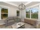 Bright living room with hardwood floors and large windows at 605 Julia Ave, Belmont, NC 28012