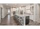 Spacious kitchen featuring white cabinets, granite countertops, and an island with seating at 1501 Liberty Row Dr, Fort Mill, SC 29708