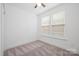 Well-lit bedroom with neutral carpet and window blinds at 4018 Capital Ridge Ct, Charlotte, NC 28205