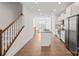 Modern kitchen with island, white cabinets and gray countertops at 4018 Capital Ridge Ct, Charlotte, NC 28205