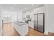 Modern kitchen with island, stainless steel appliances, and hardwood floors at 4018 Capital Ridge Ct, Charlotte, NC 28205