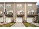 Rear view of townhouses, showcasing garages and private balconies at 4018 Capital Ridge Ct, Charlotte, NC 28205