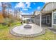 Relaxing patio with fire pit, pergola, and built-in grill at 131 Chimney Rock Ct, Denver, NC 28037