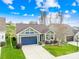 One story home with a two-car garage and landscaped yard at 131 Chimney Rock Ct, Denver, NC 28037