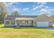 Ranch home with a large front yard and attached garage at 150 Morrison Creek Rd, Statesville, NC 28625