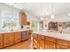 Kitchen with stainless steel appliances, light wood cabinets, and breakfast bar at 150 Morrison Creek Rd, Statesville, NC 28625