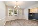 Bright dining room with hardwood floors and wainscoting at 2255 Sides Rd, Rockwell, NC 28138