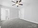 Spacious bedroom with ceiling fan and gray carpeting at 306 Flat Rock St, Clover, SC 29710