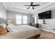 Main bedroom with king-size bed and large TV at 11608 Solstice Way, Huntersville, NC 28078