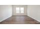 Spacious bedroom with hardwood floors and a large window at 1024 Seven Sisters Ave, Monroe, NC 28110