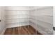 Walk-in pantry with ample shelving for storage at 1024 Seven Sisters Ave, Monroe, NC 28110