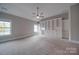 Spacious bedroom with built-in shelving and carpeting at 10881 Greenvale Dr, Harrisburg, NC 28075