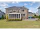 Two story brick home with large screened porch and patio at 10881 Greenvale Dr, Harrisburg, NC 28075