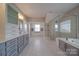 Elegant bathroom with a large shower and soaking tub at 10881 Greenvale Dr, Harrisburg, NC 28075