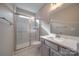 Bathroom with walk-in shower, gray vanity, and quartz countertop at 10881 Greenvale Dr, Harrisburg, NC 28075