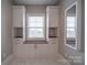 White vanity with wood top and storage at 10881 Greenvale Dr, Harrisburg, NC 28075