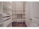 Walk-in pantry with ample shelving for storage at 10881 Greenvale Dr, Harrisburg, NC 28075