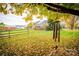 Serene backyard with wind chimes and autumn leaves at 326 Thistle Ln, Statesville, NC 28625