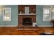 Brick fireplace with mantel, creating a cozy focal point in the living room at 326 Thistle Ln, Statesville, NC 28625