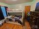 bedroom with bunk bed and hardwood floors at 3608 Crestridge Dr, Charlotte, NC 28217