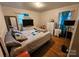 Bedroom featuring a double bed, dresser, and teal curtains at 3608 Crestridge Dr, Charlotte, NC 28217