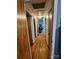 Long hallway with wood floors and access to bedrooms at 3608 Crestridge Dr, Charlotte, NC 28217