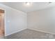 Simple bedroom with neutral walls and carpet flooring at 14905 Tamarack Dr, Charlotte, NC 28278